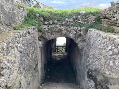A narrow tunnel towards the sea