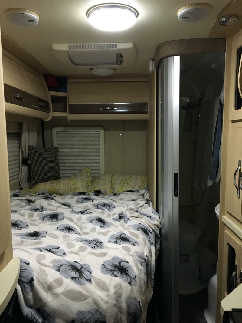 Inside the van - bed and bathroom.