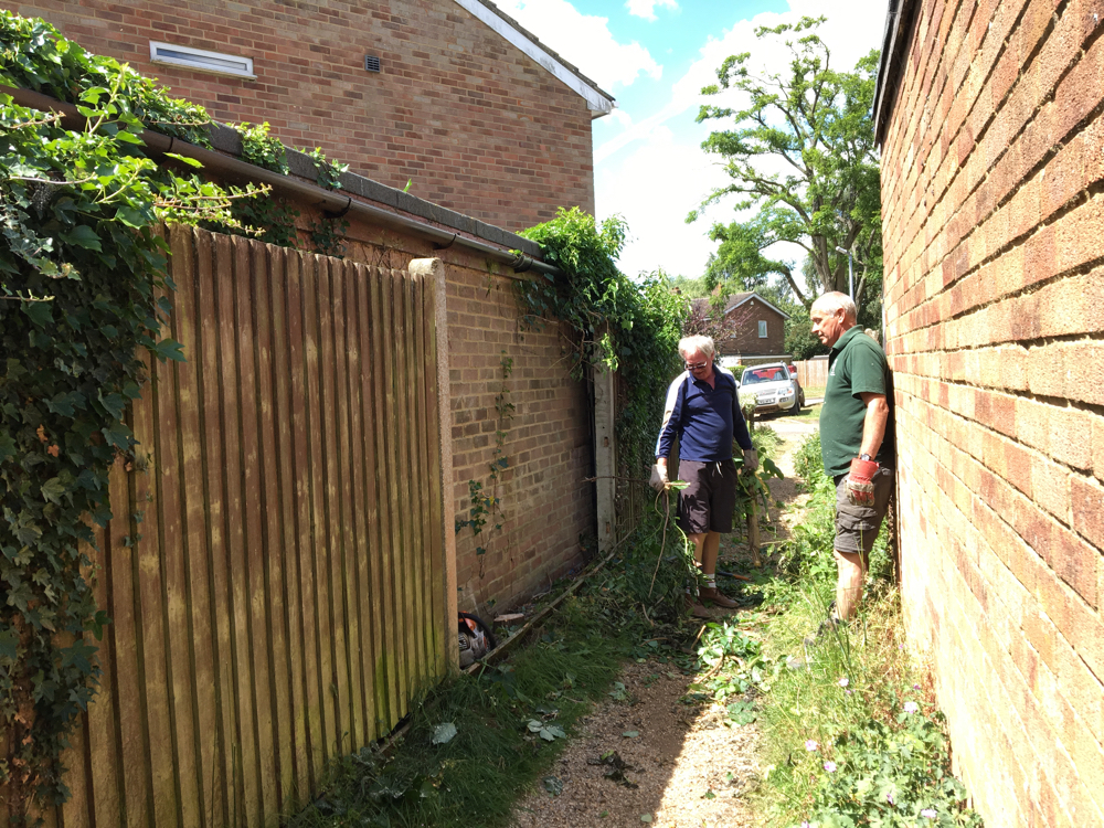 Kevin and Steve in the alleyway after removing one panel.