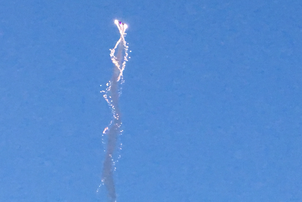 Vertical twisting plane with 'streamers'