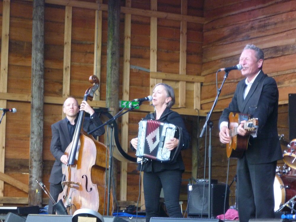 The Gerry Colvin Band performing on stage.