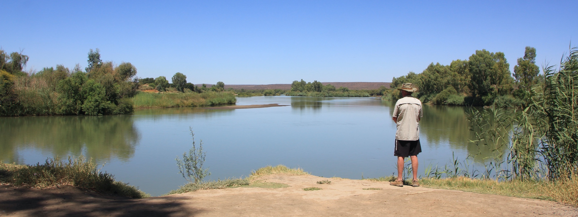 Kevin standing at the confluence of the Orange and Vaal Rivers.