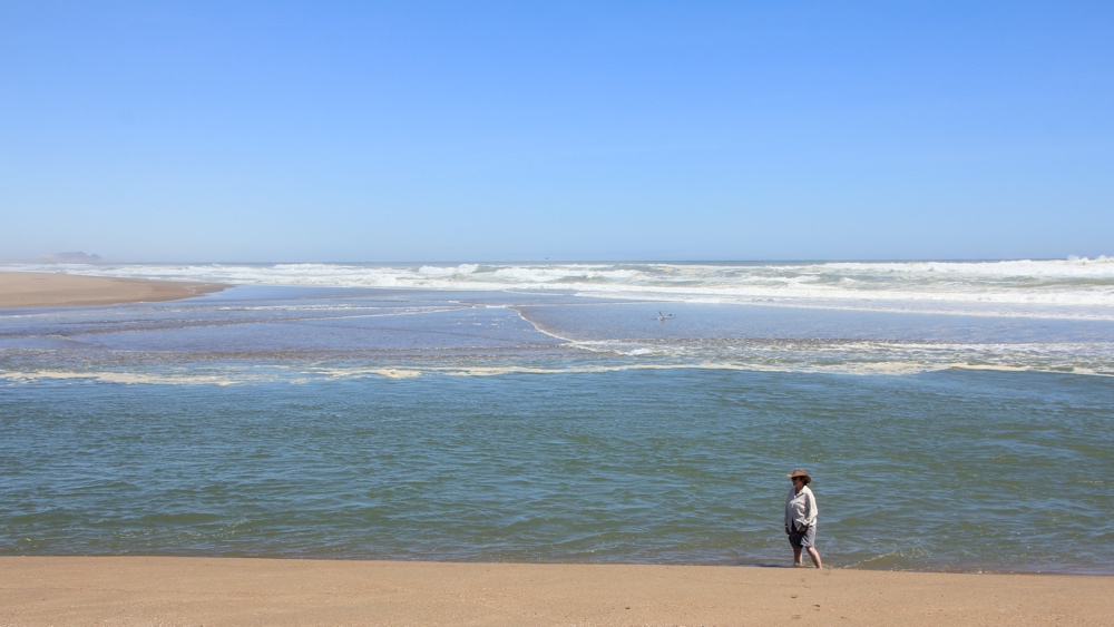  Standing at the point where the Orange RIver enters the Atlantic Ocean.
