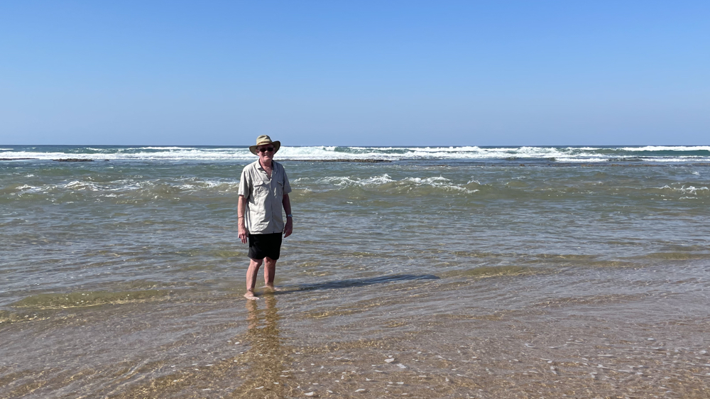 Kevin paddling in the sea.