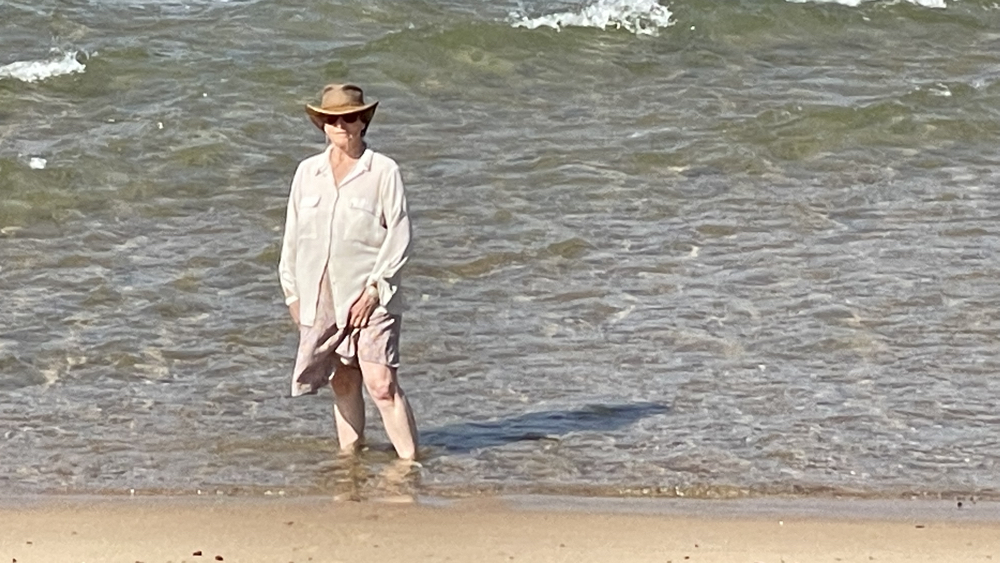 Michelle paddling in the sea.
