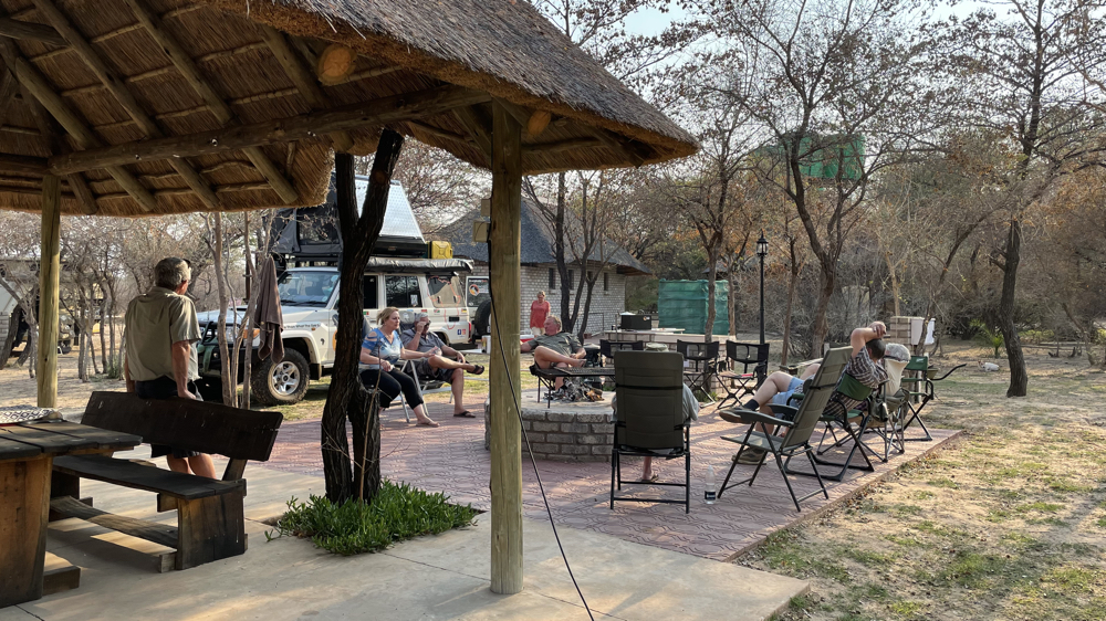Sitting and chatting at Palm Afrique campsite.
