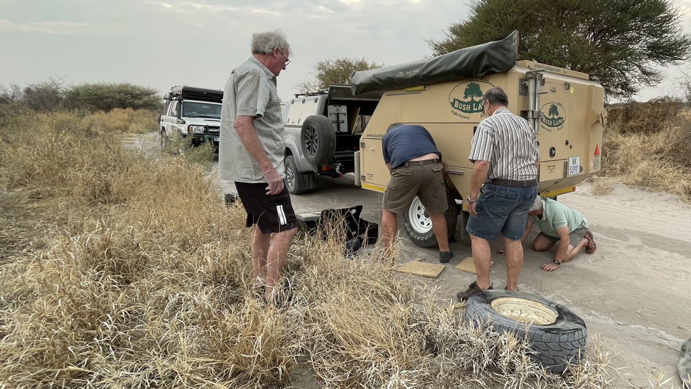 Changing the wheel on the trailer.