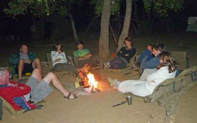 Sitting around at campfire.